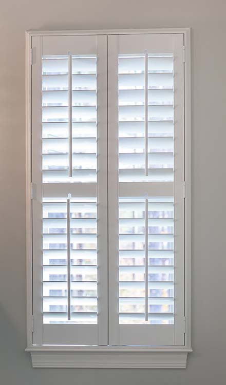 Parke® Shutters closeup view of Parke® Shutters in a window with a divider rail