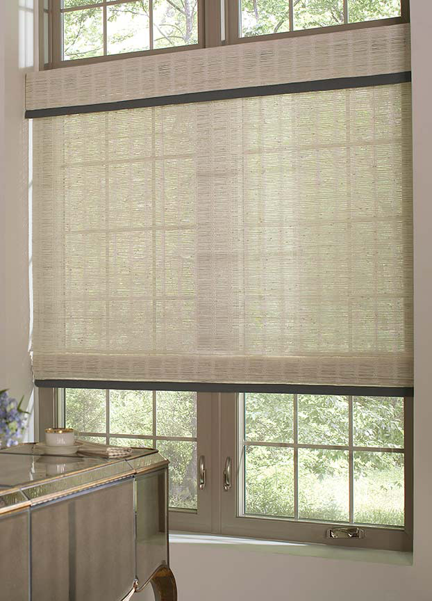 Manh Truc® Woven Wood Shades An ivory traditional flat woven wood shade and valance hang in the casement window of a classy home office.